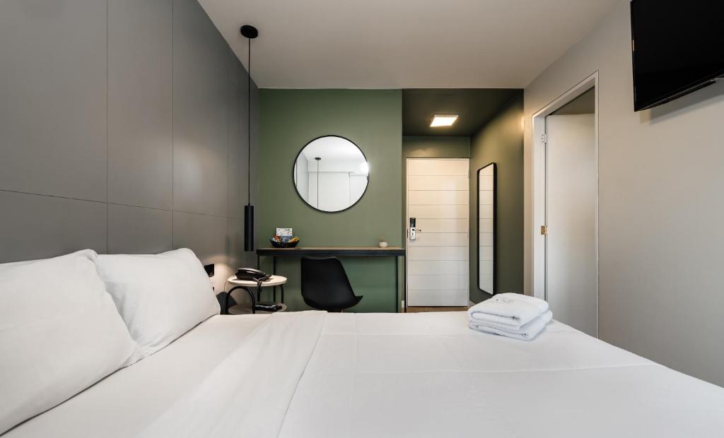 Postel nebo postele na pokoji v ubytování Miraflores Suites Centro