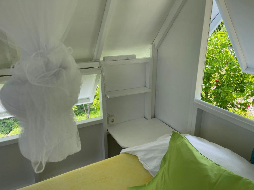 Letto o letti in una camera di Alaroots Fakarava