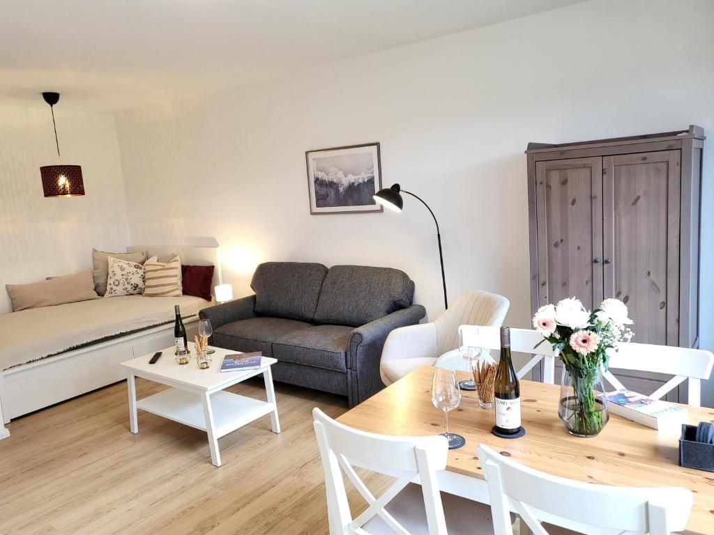 a living room with a couch and a table at Klaus Huus in Böhl
