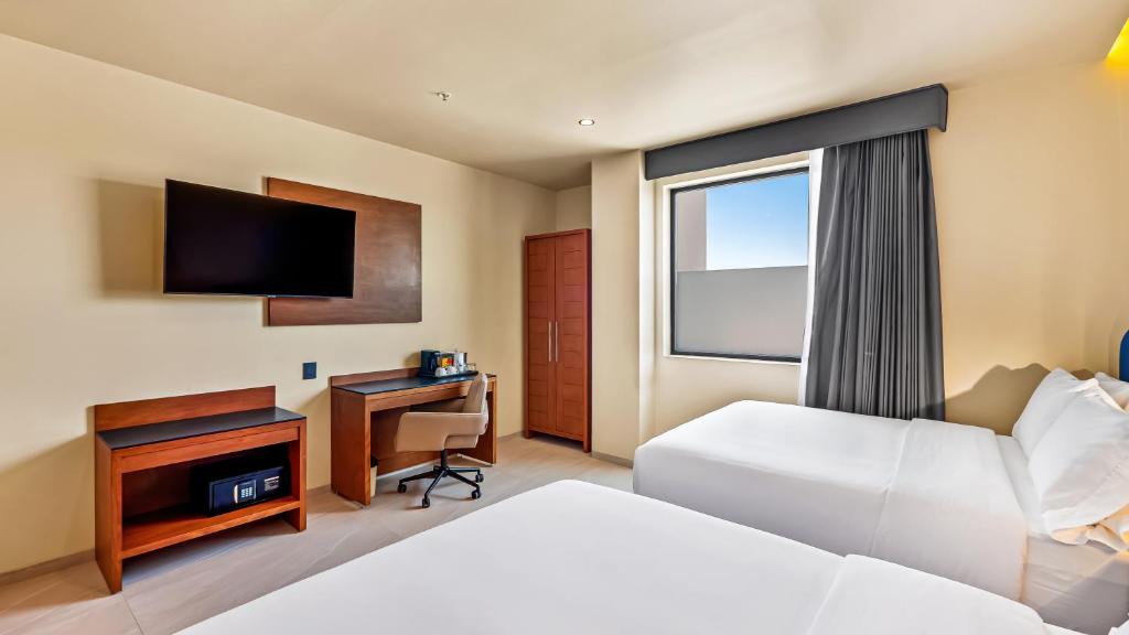 TV a/nebo společenská místnost v ubytování Hampton By Hilton Queretaro Juriquilla