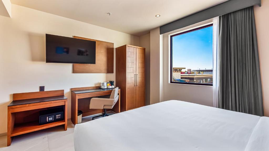 Postel nebo postele na pokoji v ubytování Hampton By Hilton Queretaro Juriquilla