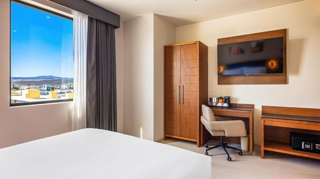 TV a/nebo společenská místnost v ubytování Hampton By Hilton Queretaro Juriquilla