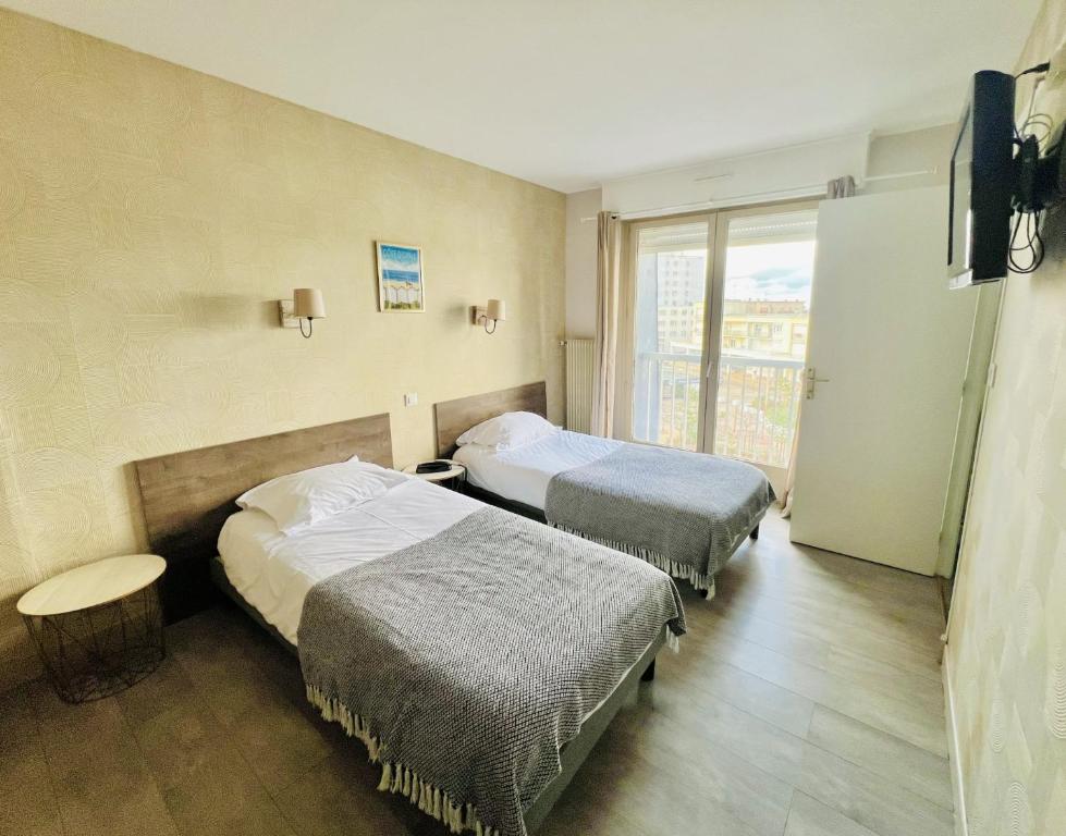 Postel nebo postele na pokoji v ubytování Hôtel Le Littoral - Berck sur Mer