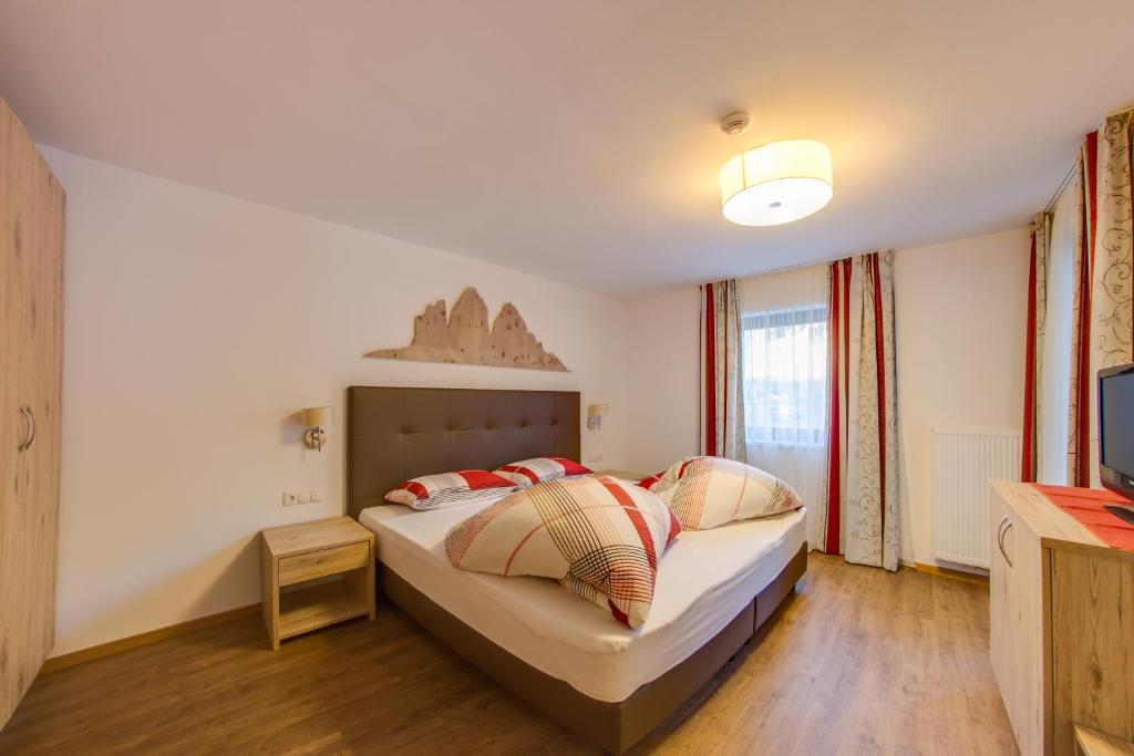 Posteľ alebo postele v izbe v ubytovaní Residence Silvia