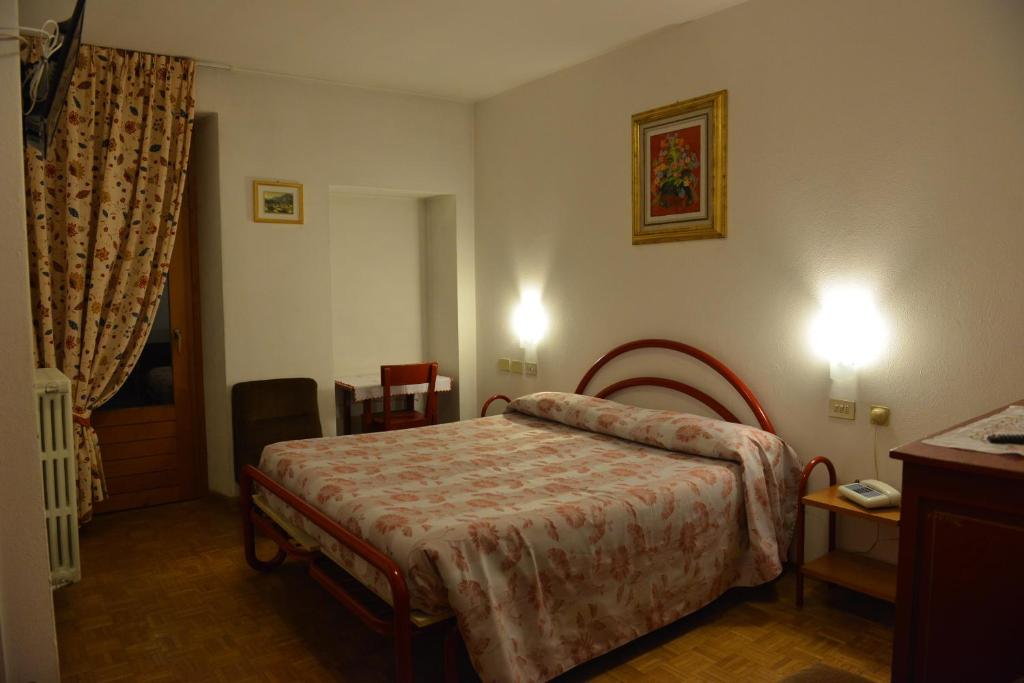 Posteľ alebo postele v izbe v ubytovaní Hotel Gufo
