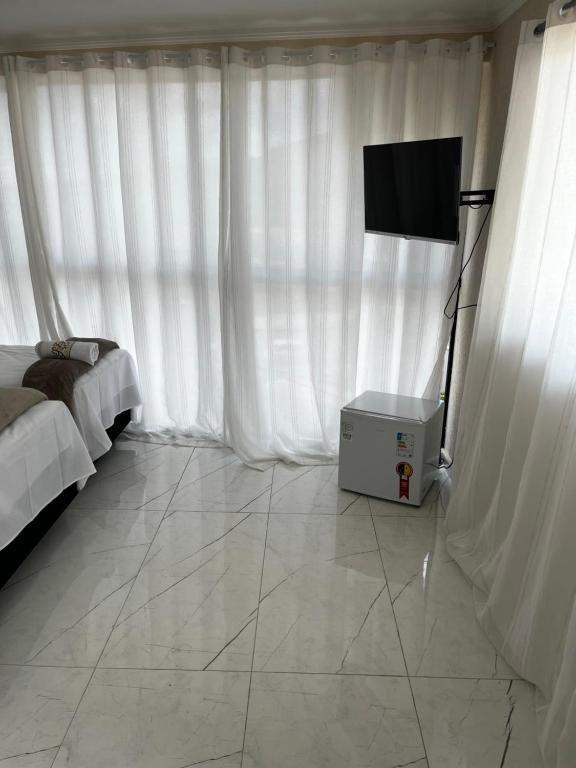 TV a/nebo společenská místnost v ubytování Hotel Aris