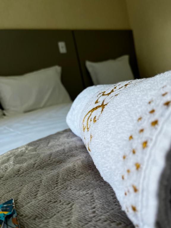 Postel nebo postele na pokoji v ubytování Hotel Aris