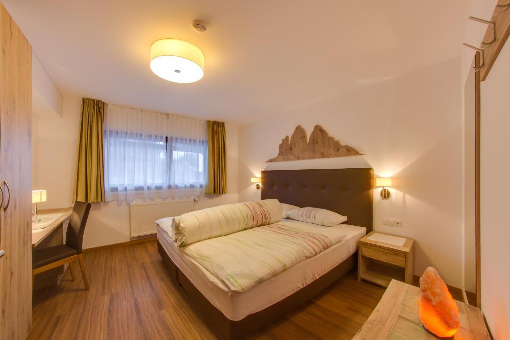 Posteľ alebo postele v izbe v ubytovaní Residence Silvia