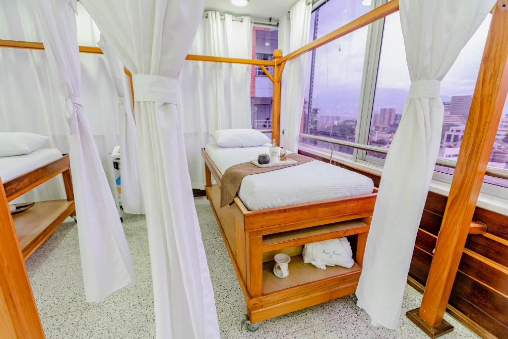 Postel nebo postele na pokoji v ubytování Hotel Du Parc