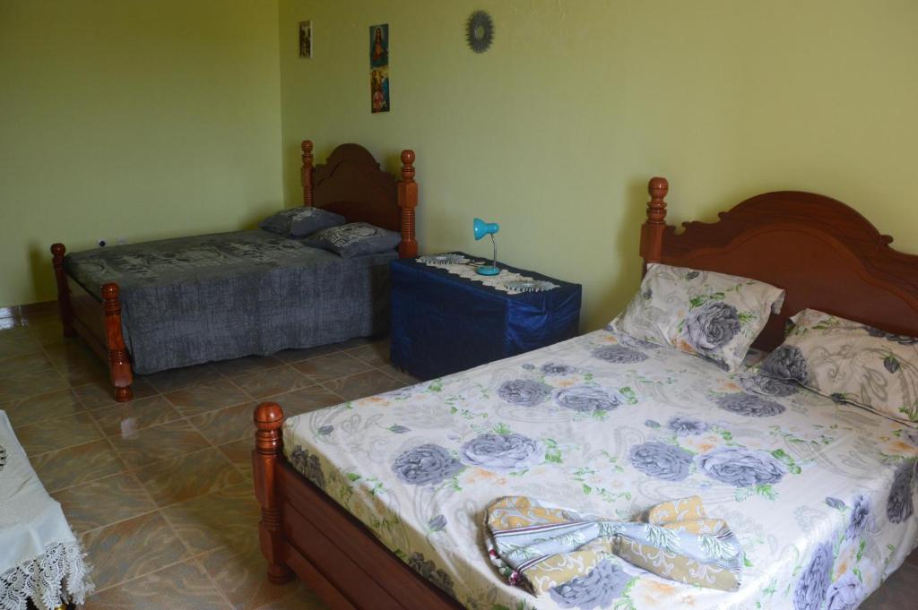 Postel nebo postele na pokoji v ubytování Casa Herminia