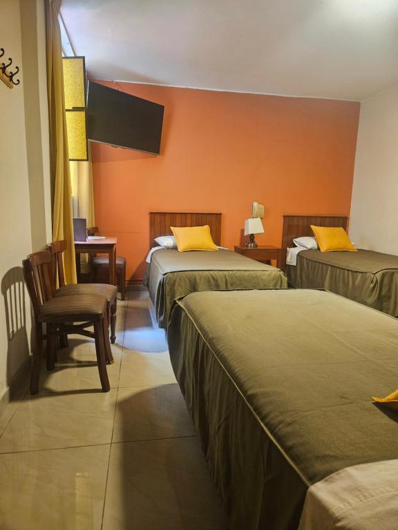 Postel nebo postele na pokoji v ubytování Hotel Acuario
