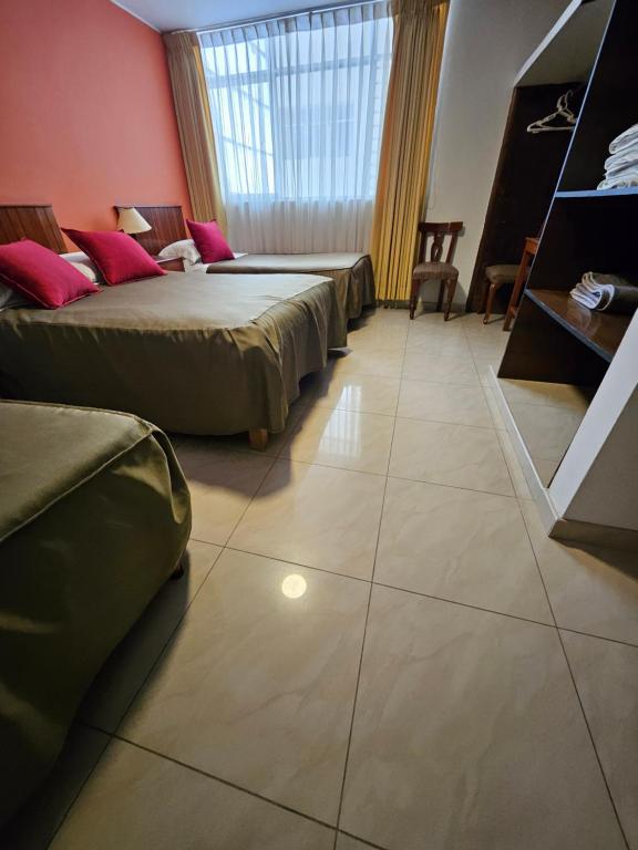 Postel nebo postele na pokoji v ubytování Hotel Acuario