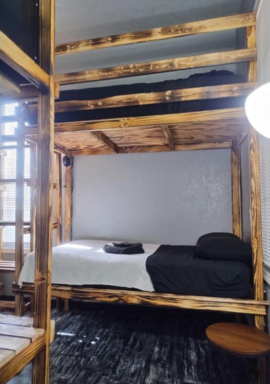 Postel nebo postele na pokoji v ubytování Palm Villa Hostel