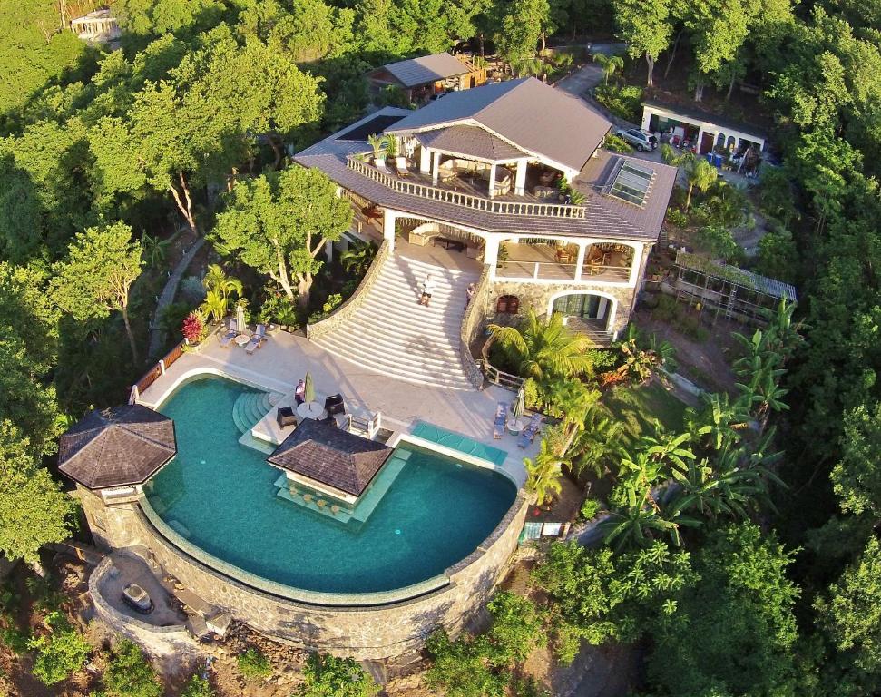 an overhead view of a large house with a swimming pool at Tropical Hideaway in Port Elizabeth