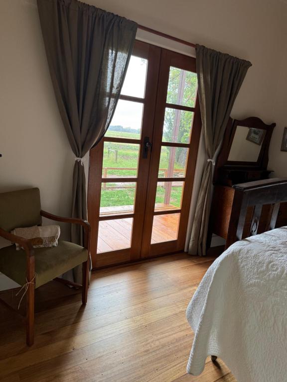 Ένα ή περισσότερα κρεβάτια σε δωμάτιο στο Myrtlebank Cottage Farmstay
