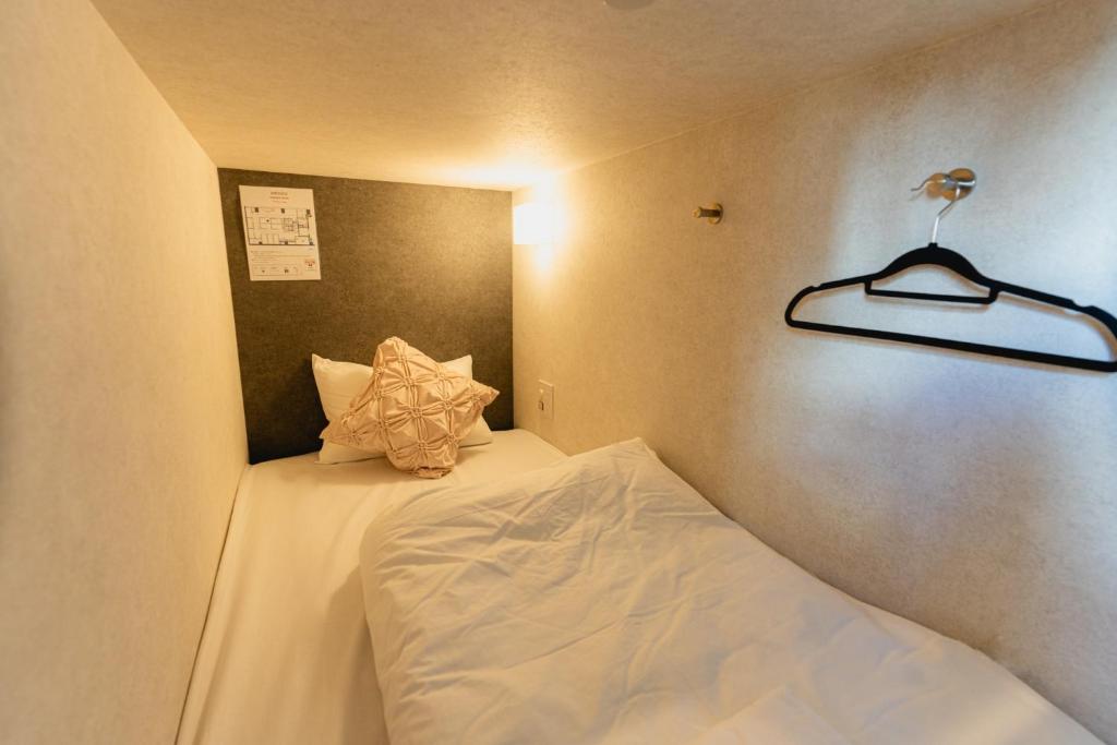 Postel nebo postele na pokoji v ubytování Guesthouse Akasaka