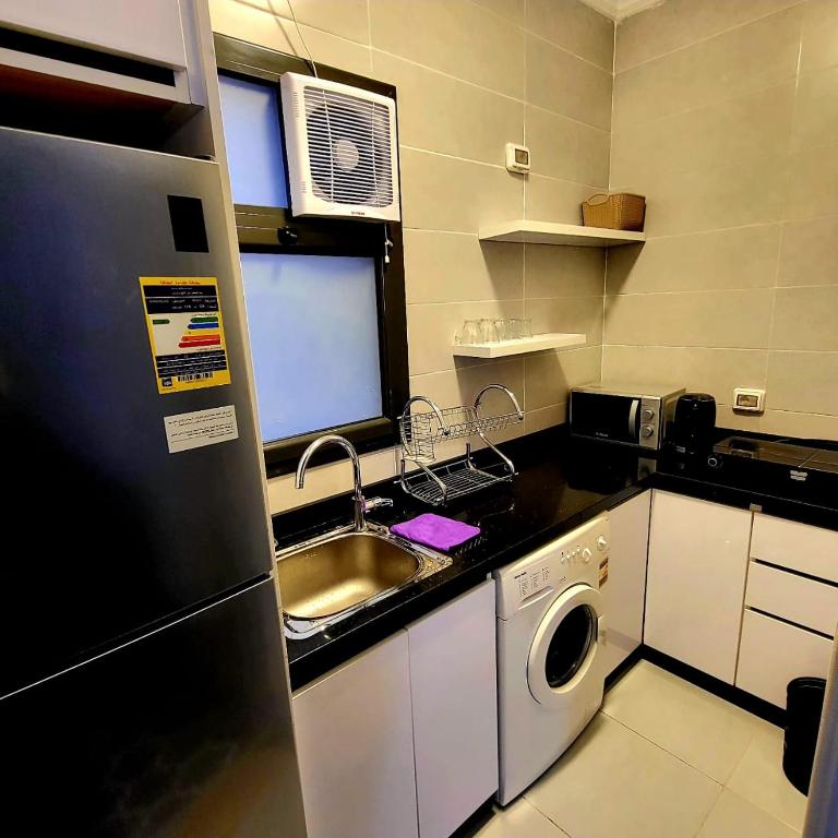Kuchyň nebo kuchyňský kout v ubytování madinaty cozy studio at privado