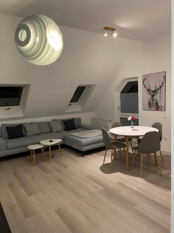 a living room with a couch and a table at Auszeit Offenburg in Offenburg
