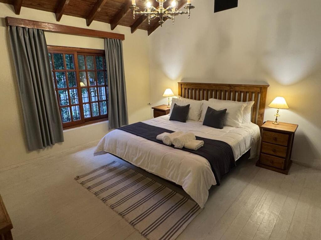 a bedroom with a large bed and a window at Carmela Inn in Monte Grande