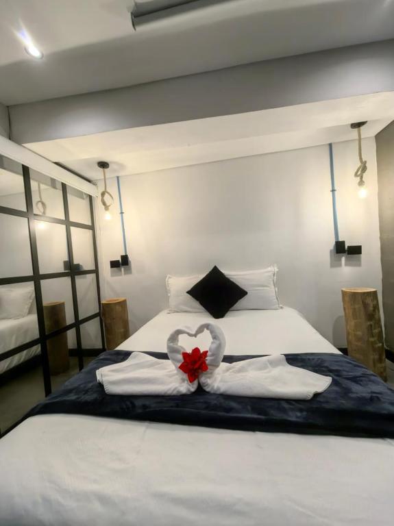 Postel nebo postele na pokoji v ubytování Hotel Quinta Bolivar