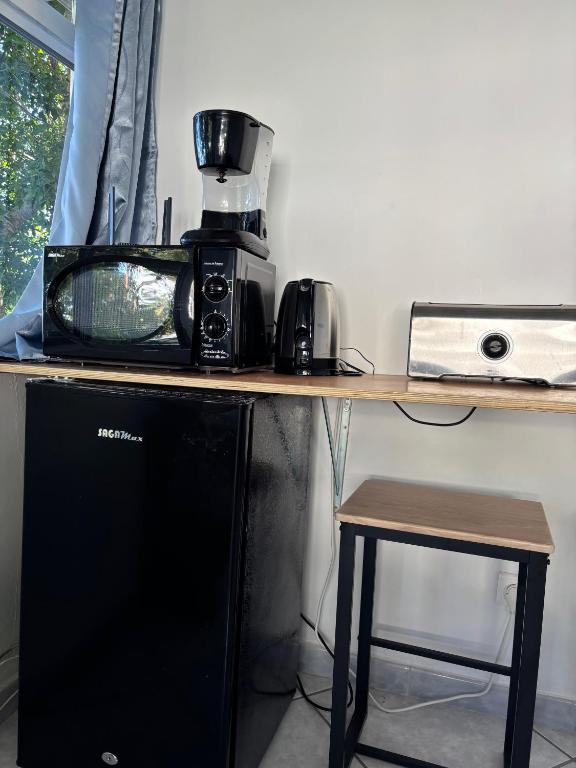 Kuchyň nebo kuchyňský kout v ubytování Manohei Lodge- Chambre indépendante Pamatai