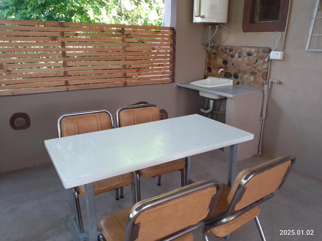 a white table and chairs in a room at Alodelrafa in San Lorenzo