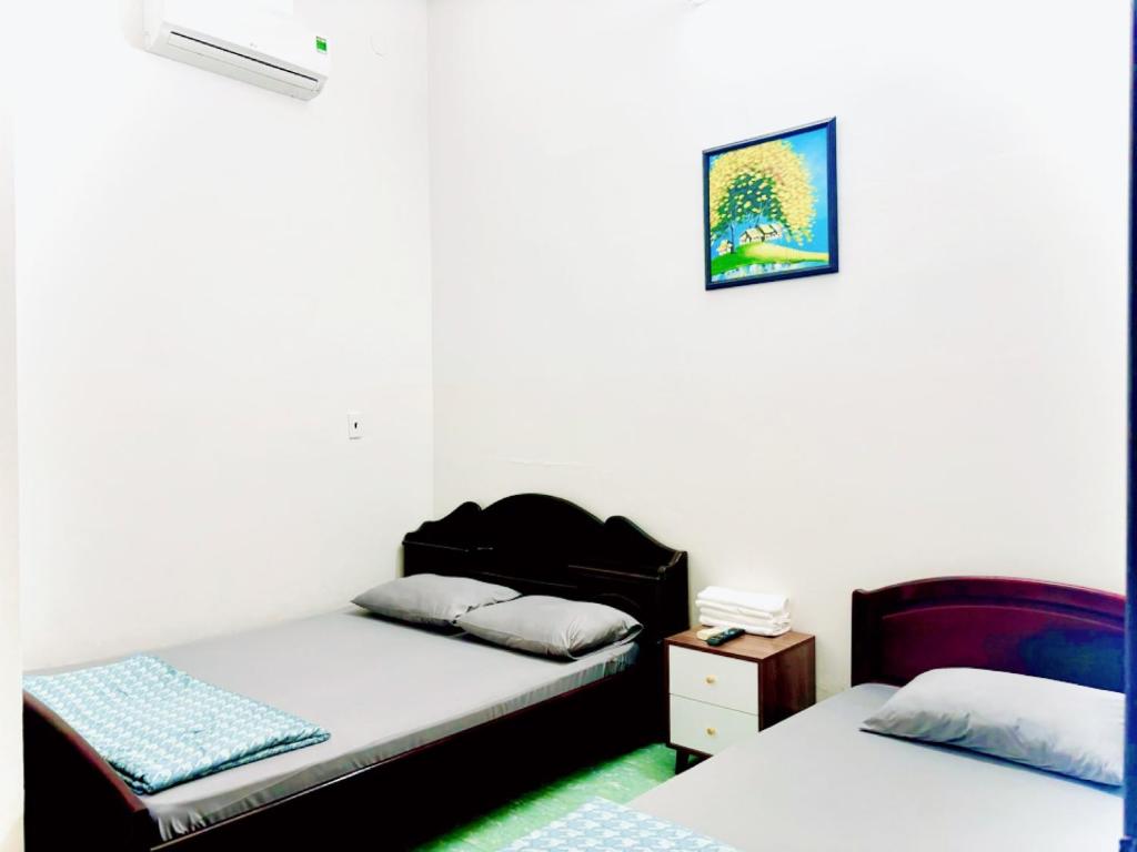 Postel nebo postele na pokoji v ubytování Hotel Minh Vy