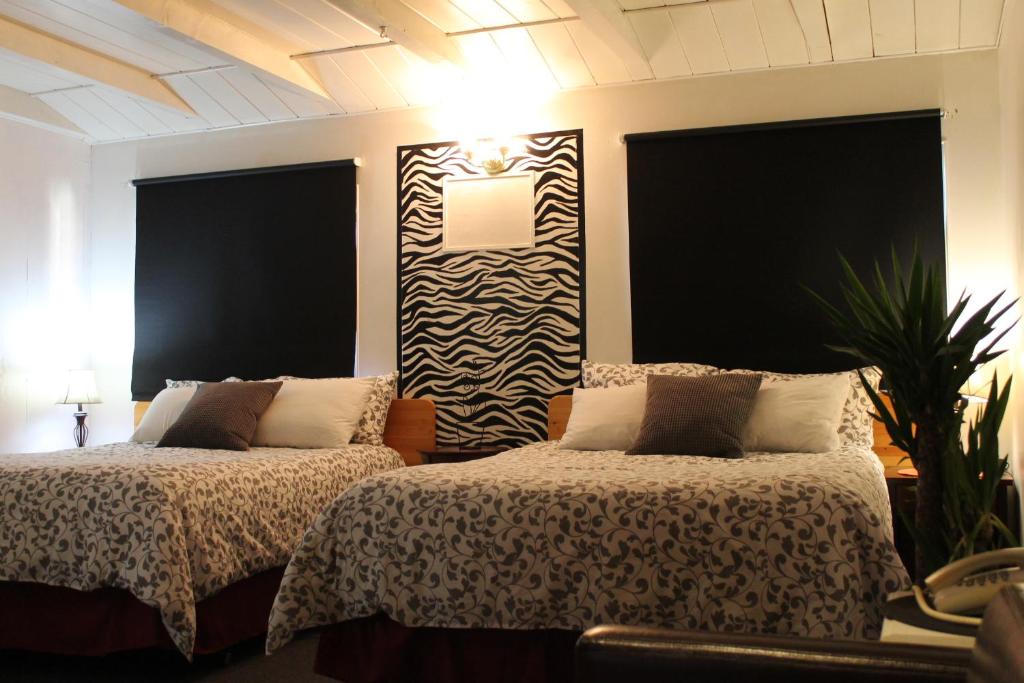 Postel nebo postele na pokoji v ubytování Sage Hills Motel