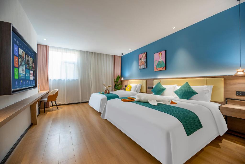 Postel nebo postele na pokoji v ubytování Spring Inn