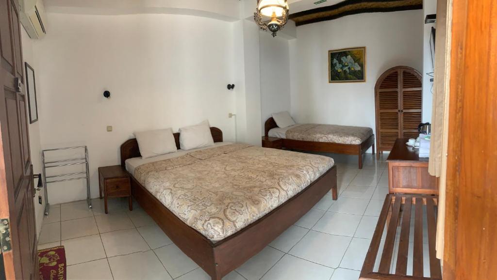 Postel nebo postele na pokoji v ubytování Bladok Hotel & Restaurant