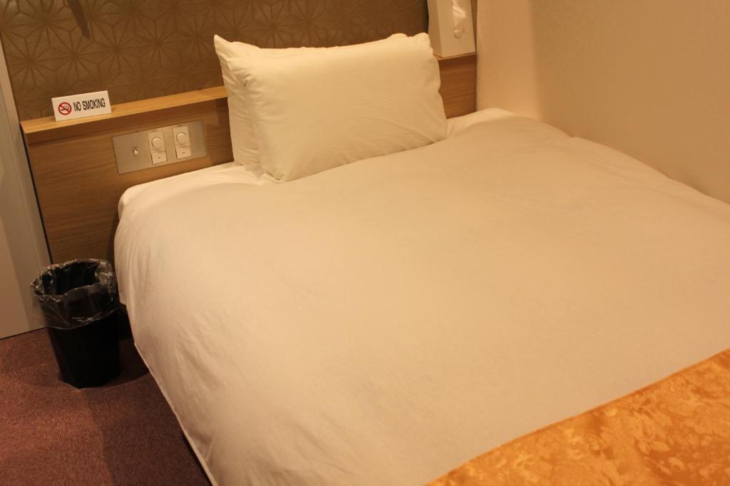 Postel nebo postele na pokoji v ubytování Hotel Boti Boti