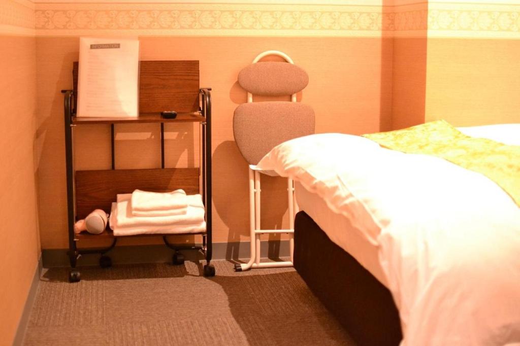 Postel nebo postele na pokoji v ubytování Hotel Boti Boti