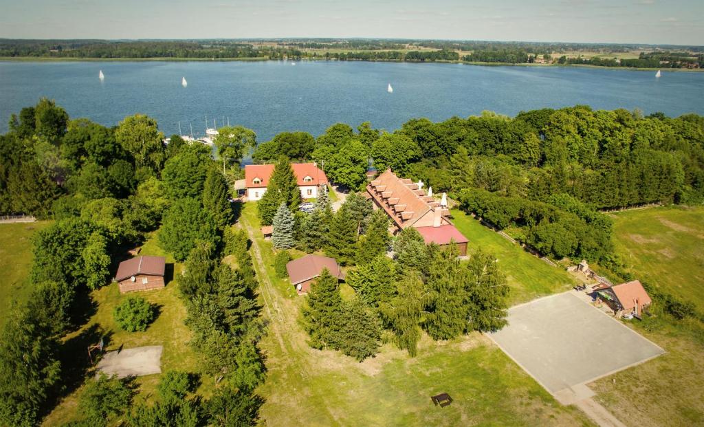 an aerial view of a house with a lake at Gościniec Hetman in Mikołajki