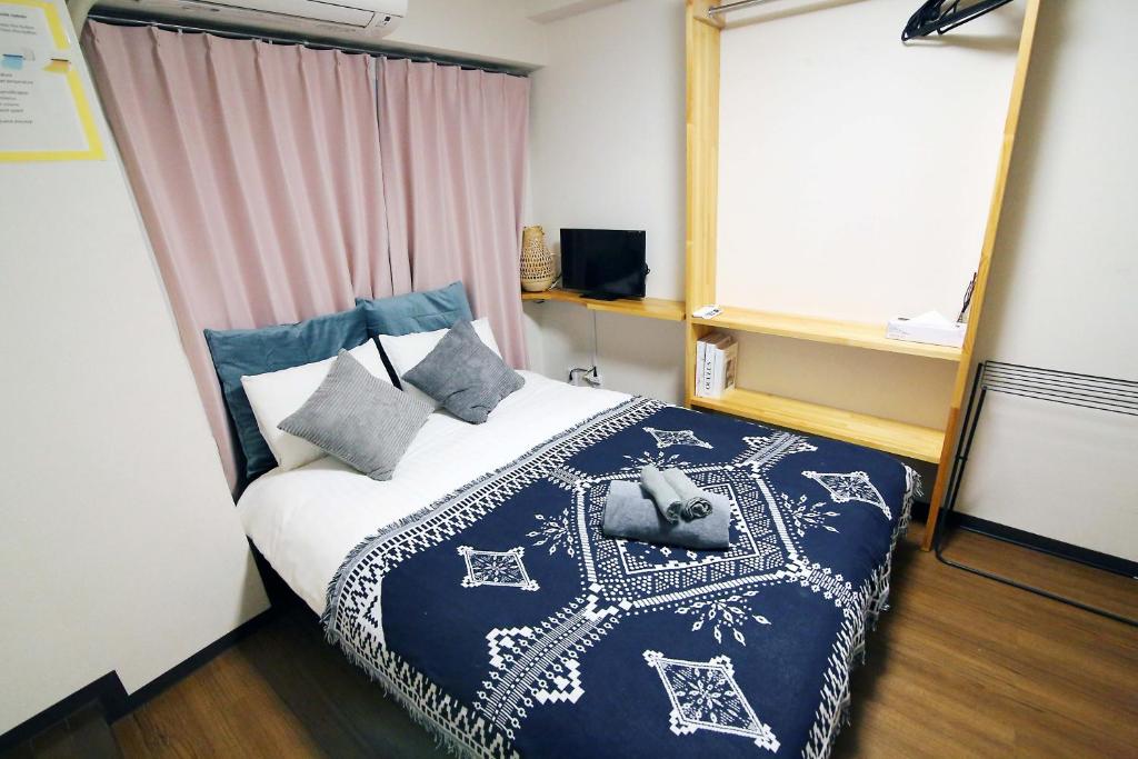 Llit o llits en una habitació de Nogata House