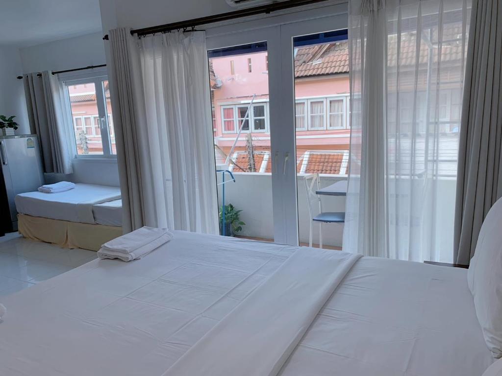 Postel nebo postele na pokoji v ubytování Sunshine Guest House
