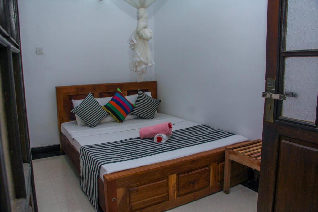Postel nebo postele na pokoji v ubytování The Sigiriya Rock Hostel