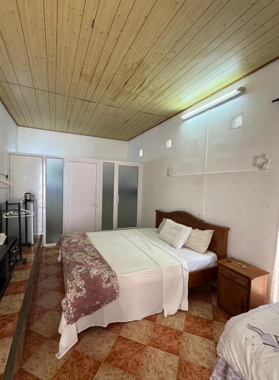 Postel nebo postele na pokoji v ubytování JN sunflower residence