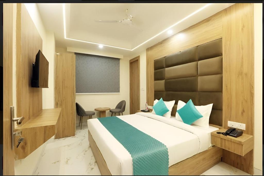 Postel nebo postele na pokoji v ubytování Hotel Oakwood