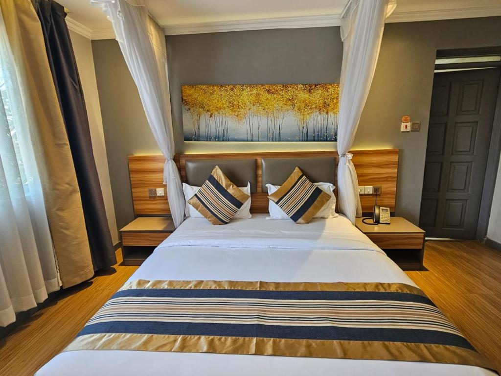 Postel nebo postele na pokoji v ubytování Raha Suites - Westlands