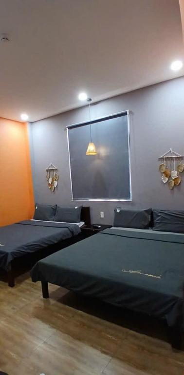 Postel nebo postele na pokoji v ubytování Thanh Hằng Homestay