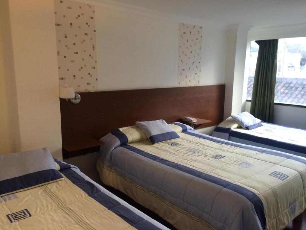 Postel nebo postele na pokoji v ubytování Gran Hotel Napoleón