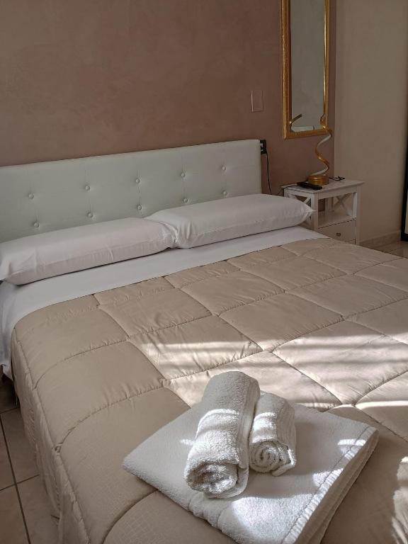 Postel nebo postele na pokoji v ubytování B&B Da Rocco