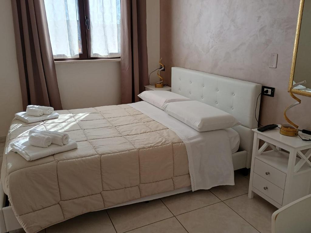 Postel nebo postele na pokoji v ubytování B&B Da Rocco