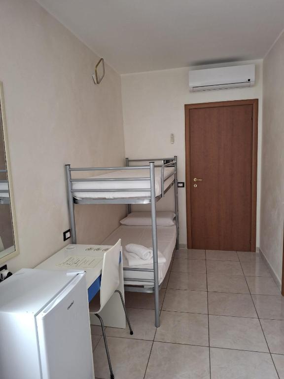 Postel nebo postele na pokoji v ubytování B&B Da Rocco