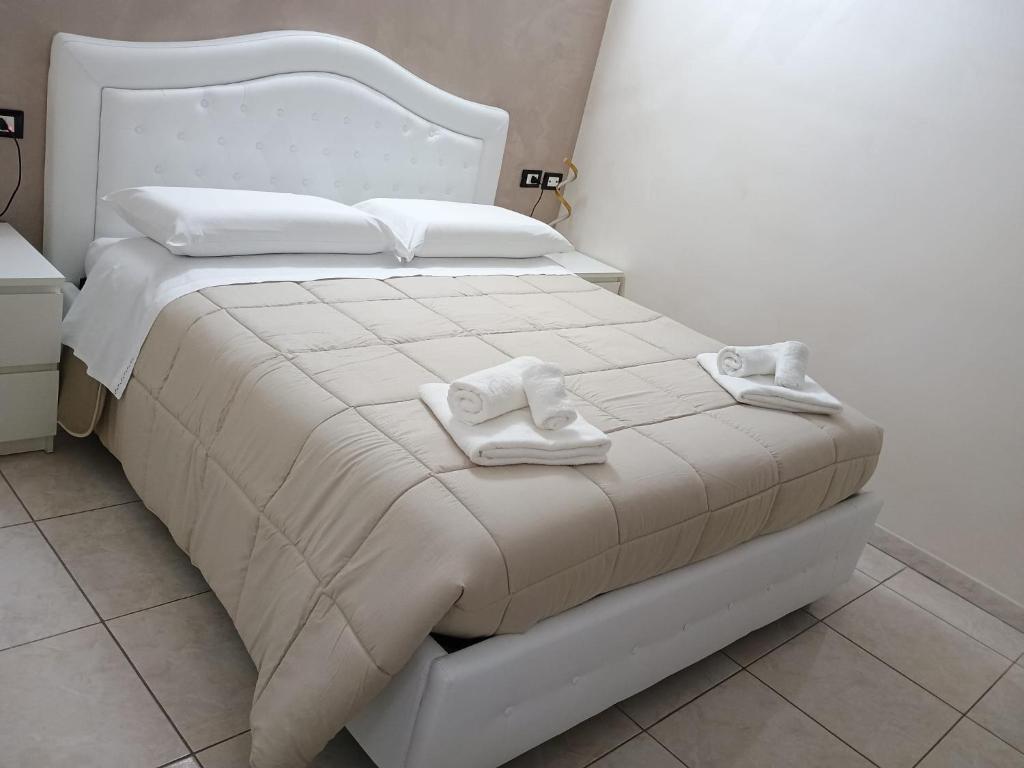 Postel nebo postele na pokoji v ubytování B&B Da Rocco