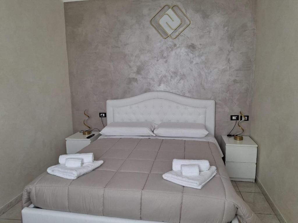 Postel nebo postele na pokoji v ubytování B&B Da Rocco