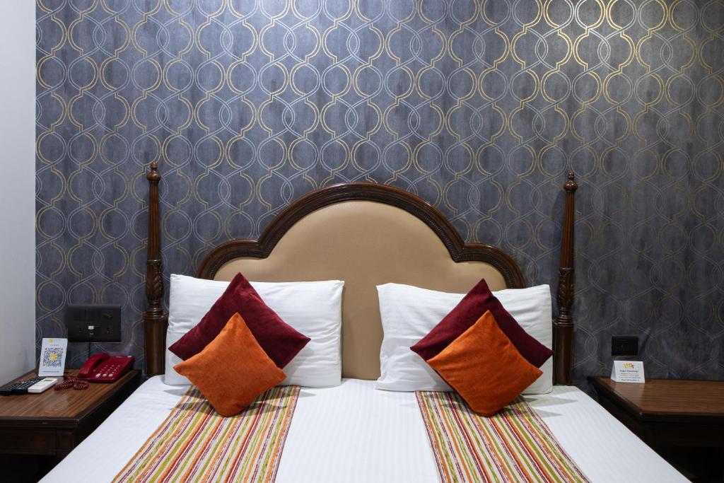 Postel nebo postele na pokoji v ubytování Hotel Sunstar Grand