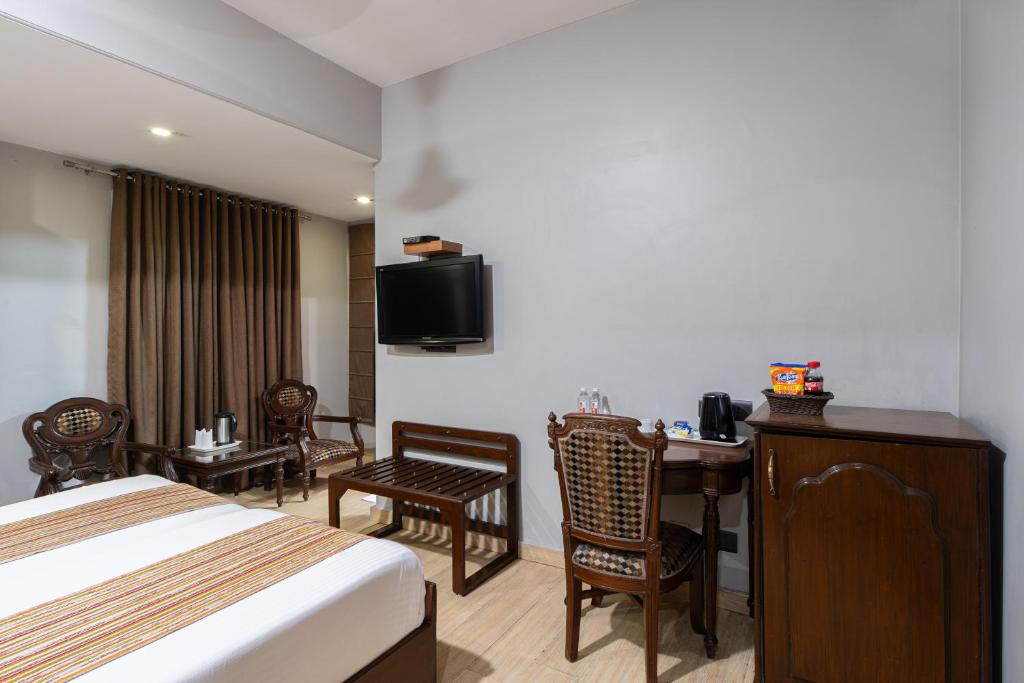 TV a/nebo společenská místnost v ubytování Hotel Sunstar Grand