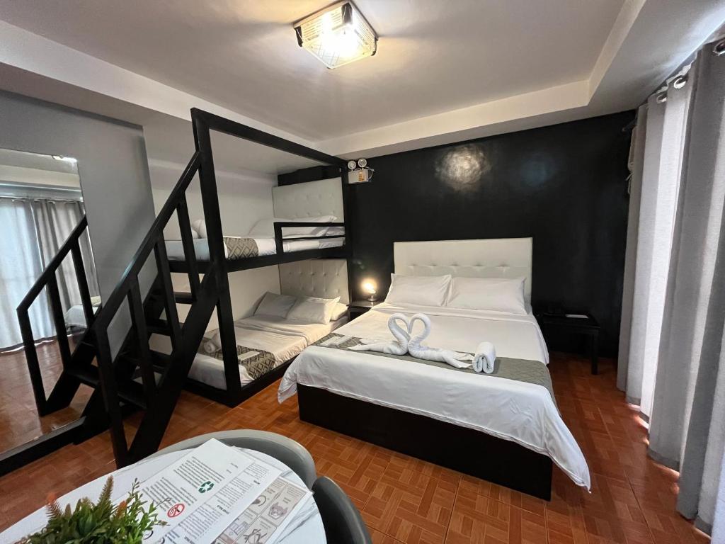Postel nebo postele na pokoji v ubytování Rangya Hotel