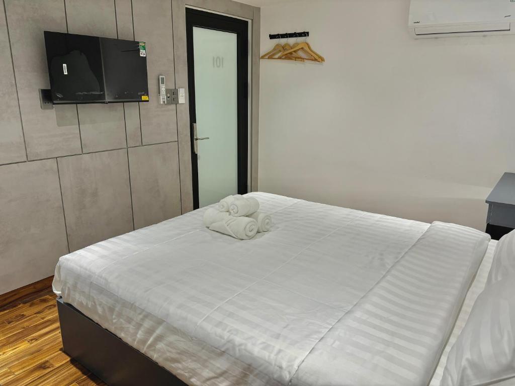 Postel nebo postele na pokoji v ubytování CEVA Hotel & Apartment Danang